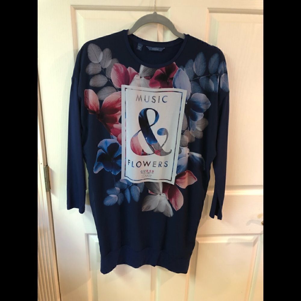 Guess tunic top, small snag line at the top